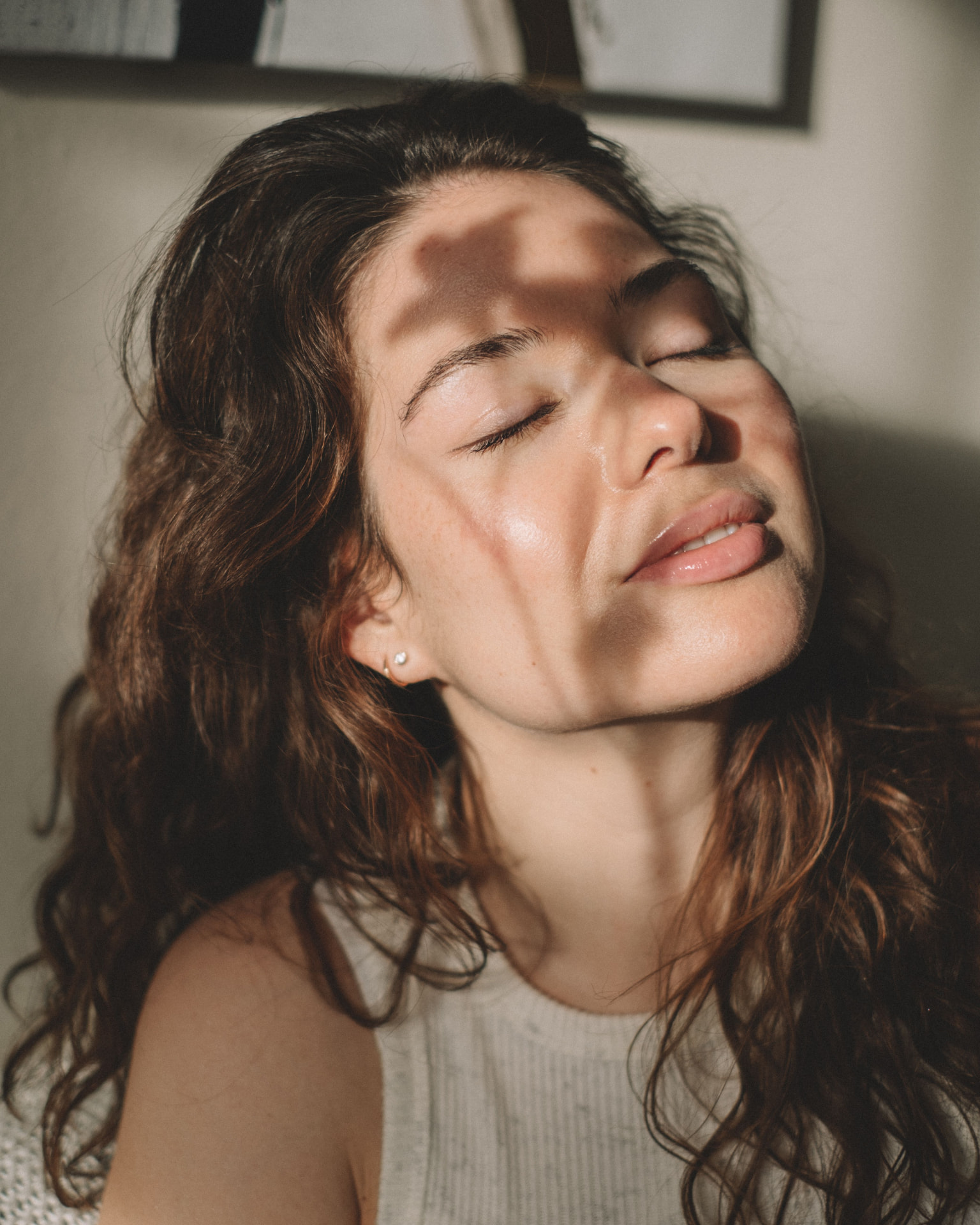 Close-up portrait with sunlight falling across the face