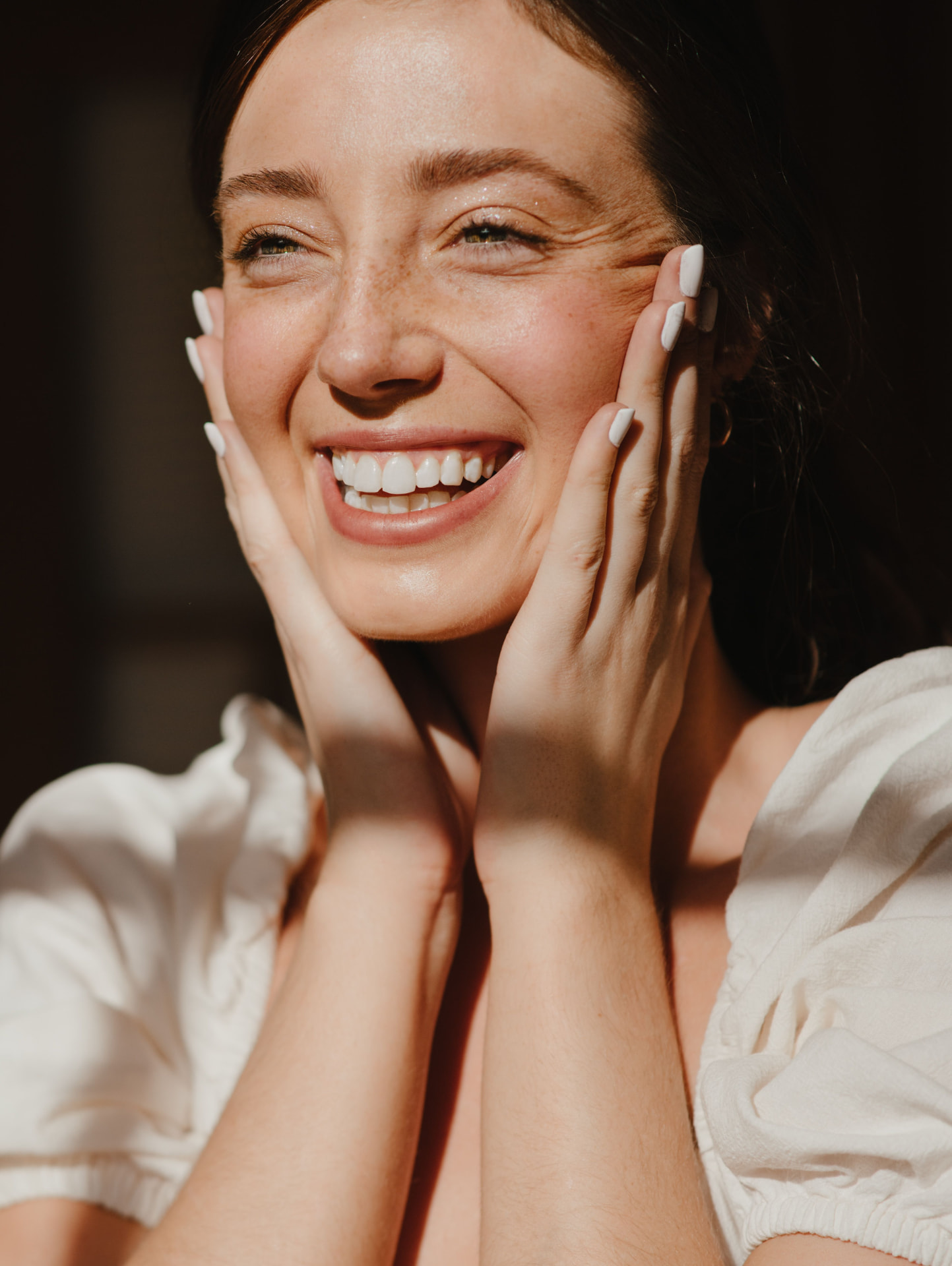 Woman smiling in bright daylight
